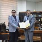 Read more about the article After being certified as an arbitrator in a British magazine… The President of the University Honors a Lecturer from the Faculty of Business and Economics